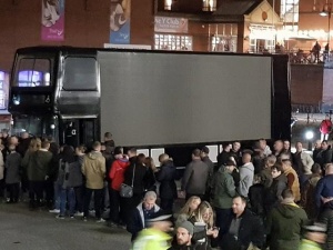 Tommy Robinson giant screen on a bus at book launch Nov 3 2017.jpg